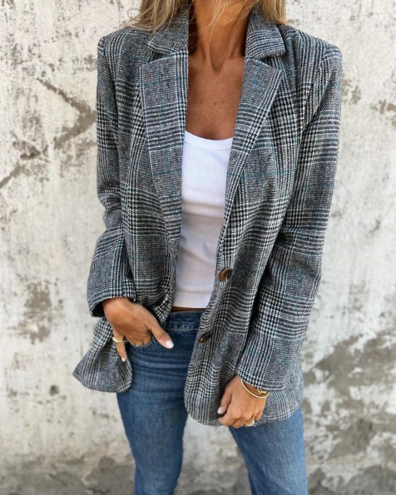 Elegant blue checkered women's blazer, a versatile long sleeve jacket for business or casual fashion. Classic outerwear.