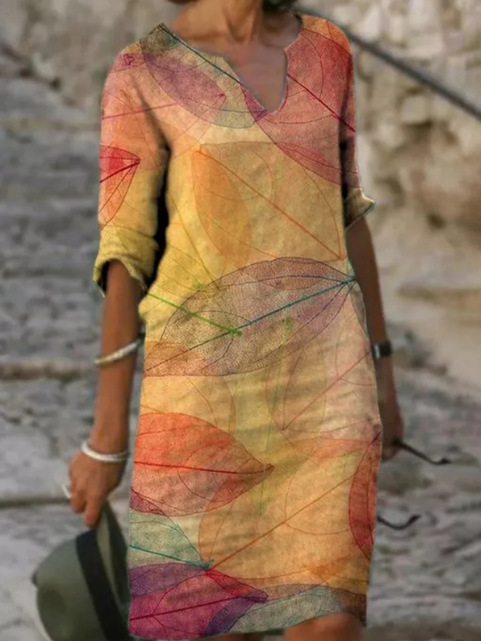 Elegant women's yellow floral printed V-neck midi dress, flowy and perfect for summer casual or elegant occasions.