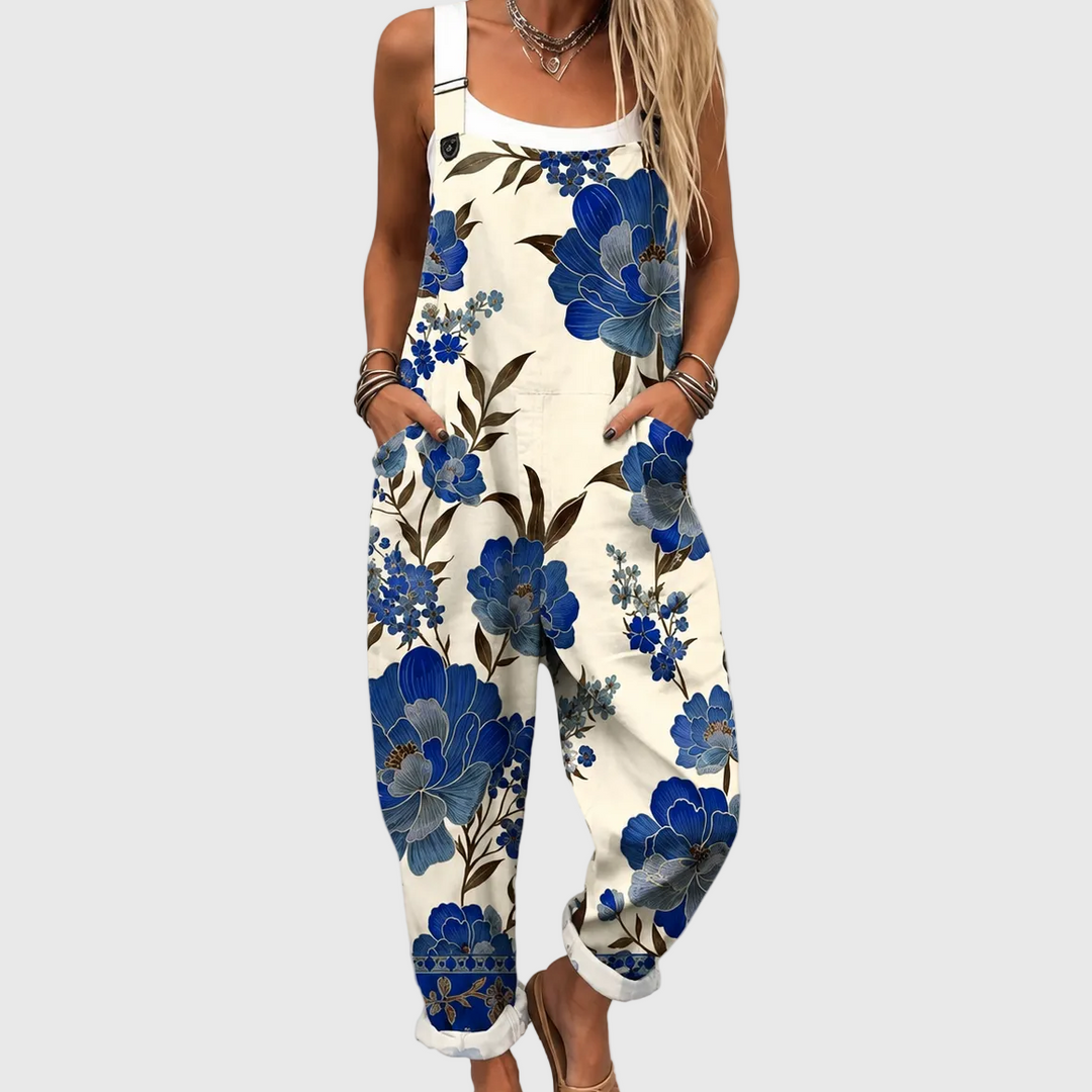 Women's royal blue floral dungaree jumpsuit, perfect casual summer outfit. Comfortable & versatile fashion.