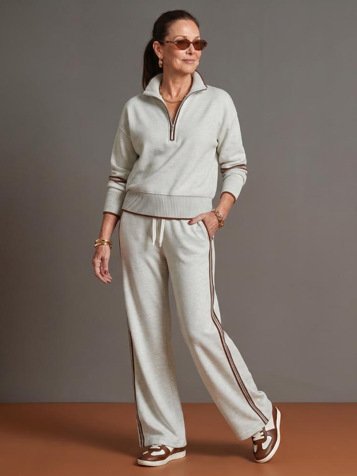 Women's chic loungewear set, featuring a stylish zip neck top & flowing wide leg trousers.