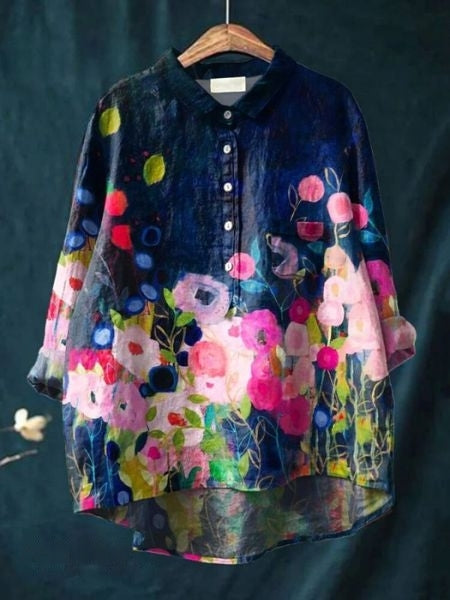 Elegant women's floral print button-up shirt, versatile for casual or dressy spring/summer style.