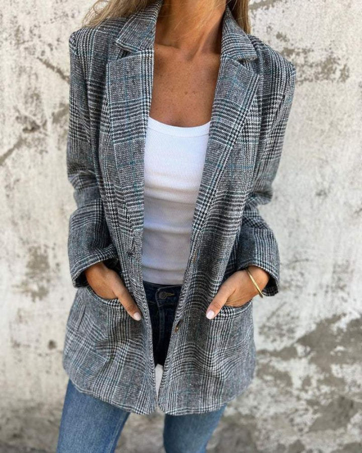 Tailored women's classic checkered blazer with a notch collar, ideal for office wear and sophisticated business looks.