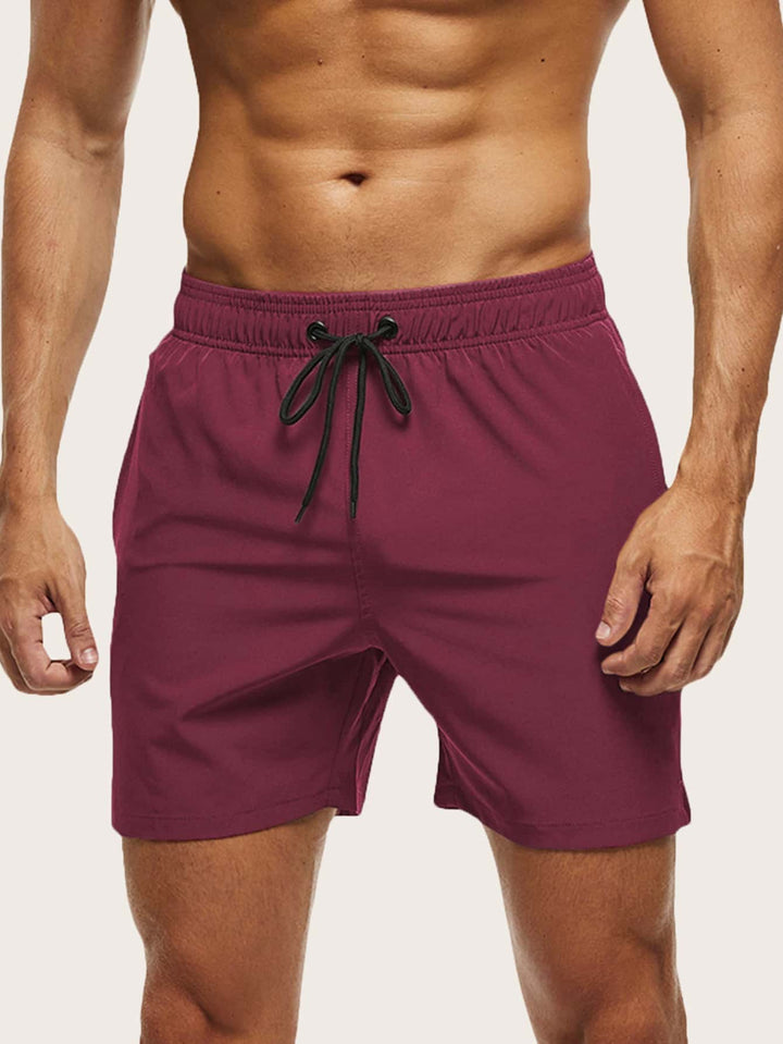 Men's quick-dry beach shorts in a vibrant color, great for swimming & active wear.