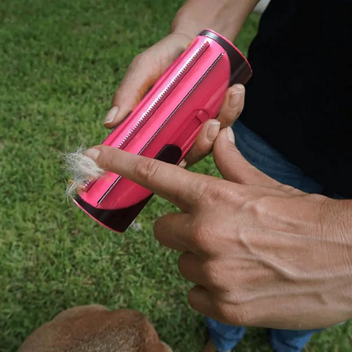 Handheld self-cleaning pet groomer roller. Convenient fur and lint removal for all pet types.