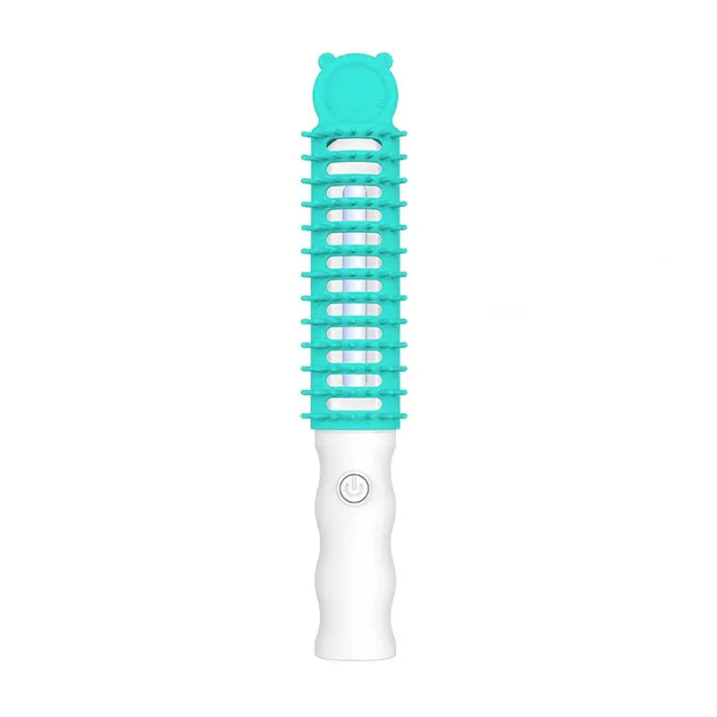 Close-up of electric pet detangling brush with soft bristles and heated element for ultimate pet comfort.