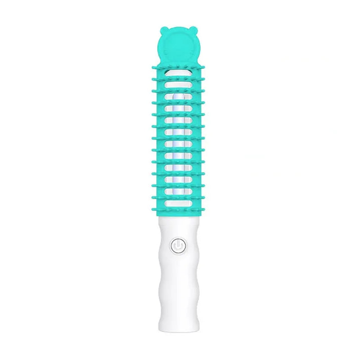 Close-up of electric pet detangling brush with soft bristles and heated element for ultimate pet comfort.