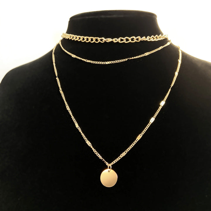 Fashionable women's layered gold necklace set, multi-chain design adds a sophisticated touch to any outfit.