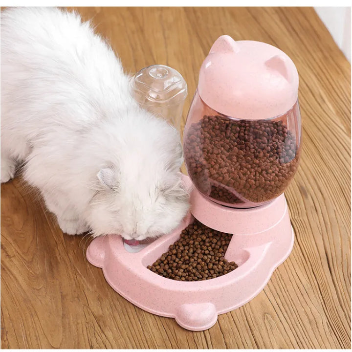 Cute automatic cat feeder dispenses fresh meals. Ideal pet tech for feline care & timed feeding.