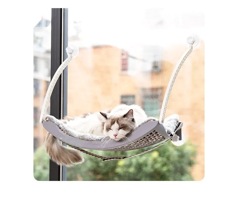 Stable cat window hammock with strong suction cups, secure elevated bed for indoor felines.