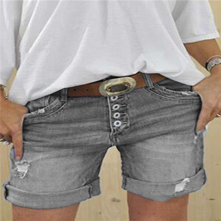 Stylish distressed women's denim shorts with trendy rips, ideal for casual summer fashion.