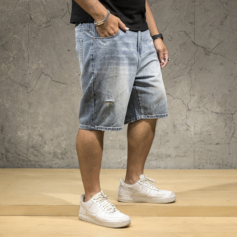 Edgy men's distressed light wash shorts, ideal for weekend wear & a casual summer look.