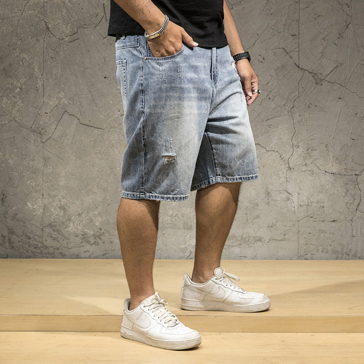 Edgy men's distressed light wash shorts, ideal for weekend wear & a casual summer look.