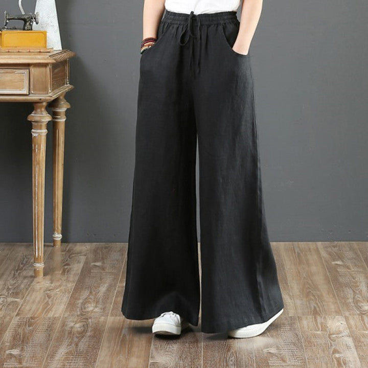 Close-up of comfortable elastic waistband on stylish women's wide leg trousers.