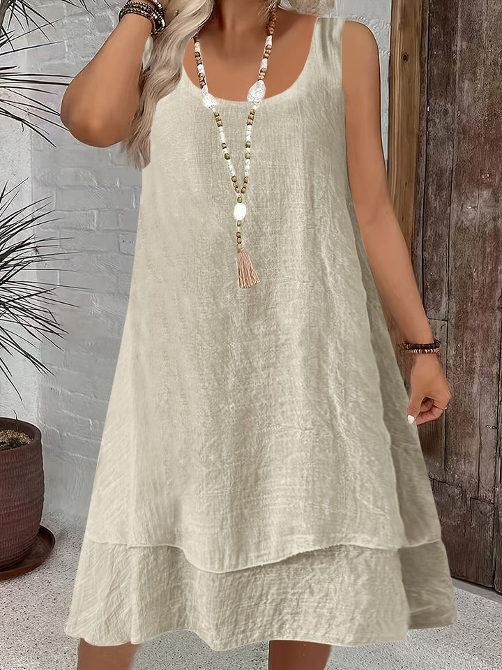 Stylish women's loose fit sleeveless dress, great for casual outings & versatile spring-summer fashion.