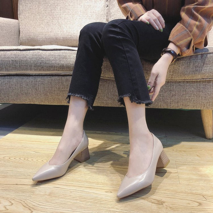 Classic black block heel pumps for women, featuring a sophisticated pointed toe. Ideal elegant dress shoes for work.