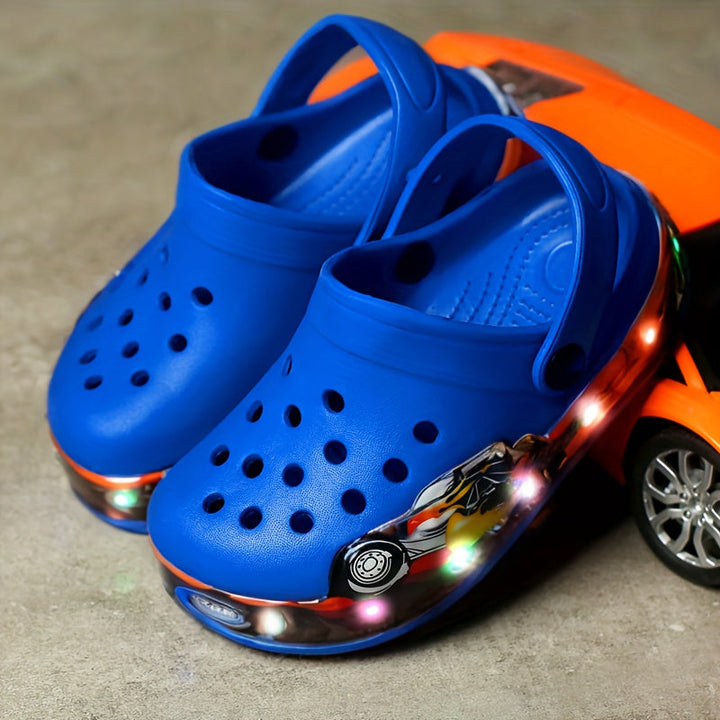 Fun glow-in-the-dark kids' clogs, breathable & anti-slip, great for evening summer adventures & play.