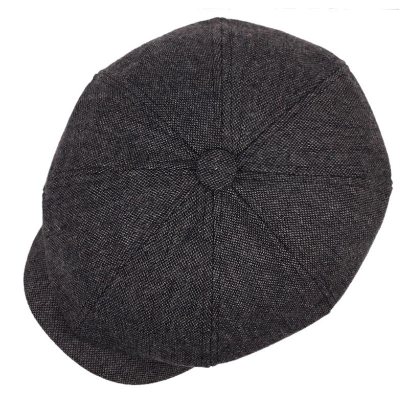 Retro men's flat cap, herringbone pattern, classic vintage fashion statement headwear.