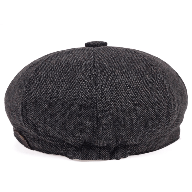 Vintage men's accessory: classic herringbone flat cap, retro driving cap style.