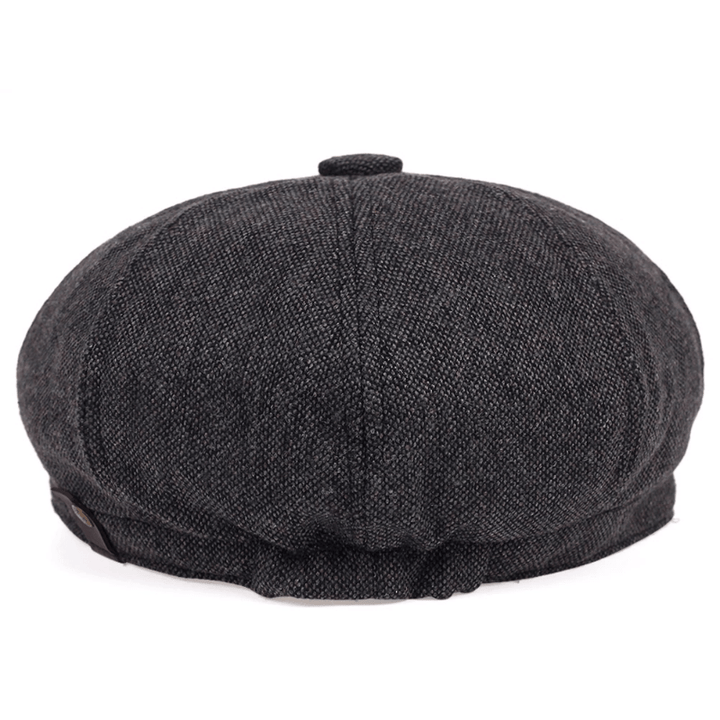 Vintage men's accessory: classic herringbone flat cap, retro driving cap style.