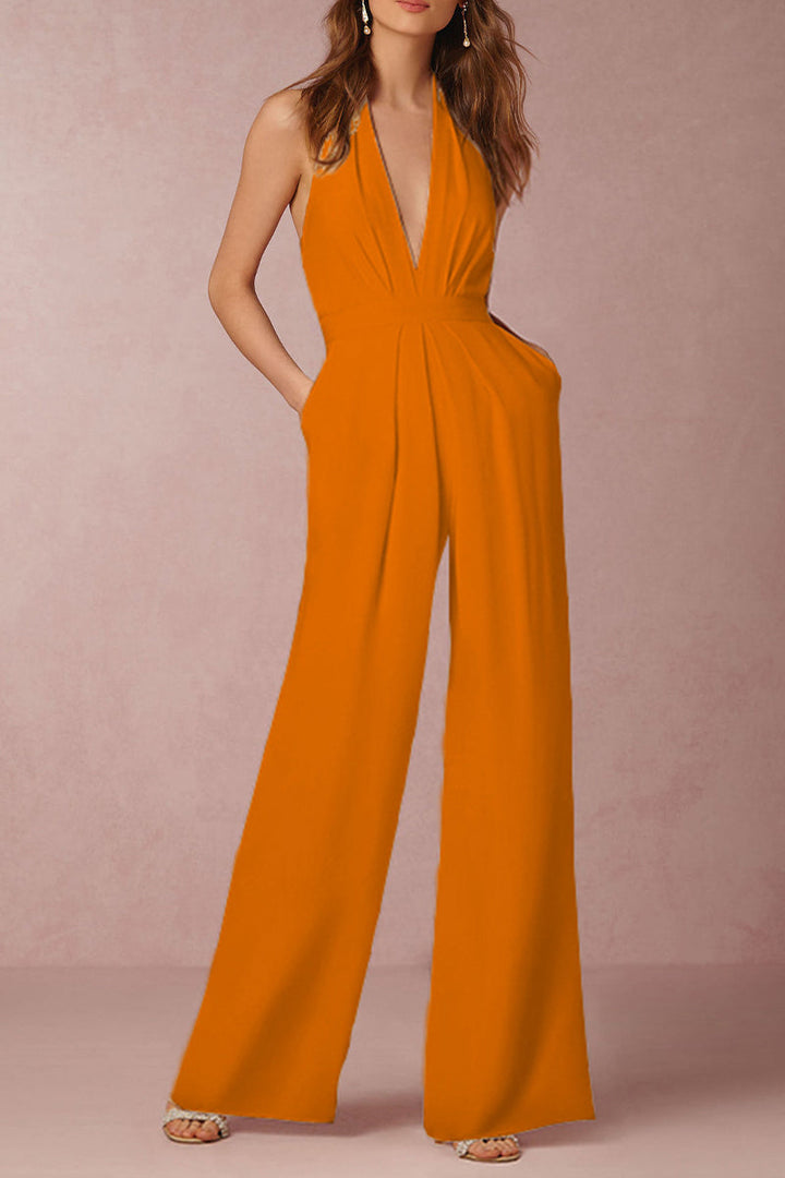 Sophisticated women's sleeveless V-neck jumpsuit. Elegant backless style, solid color. Perfect formal party or evening outfit.