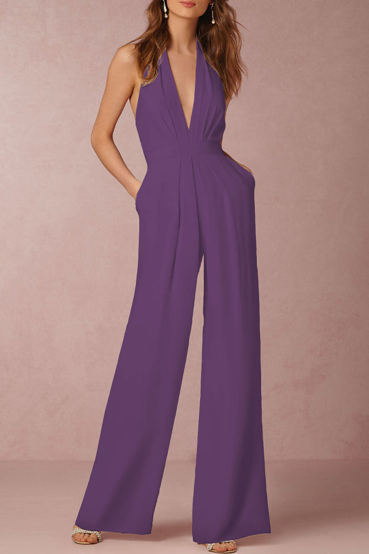 Women's elegant V-neck jumpsuit for evening parties. Sophisticated backless design, sleeveless. Perfect formal event attire.