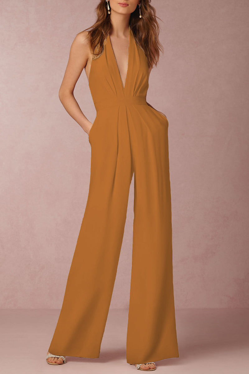 Chic modern backless V-neck jumpsuit for women. Elegant solid color, sleeveless. Perfect for a stylish evening or formal event.