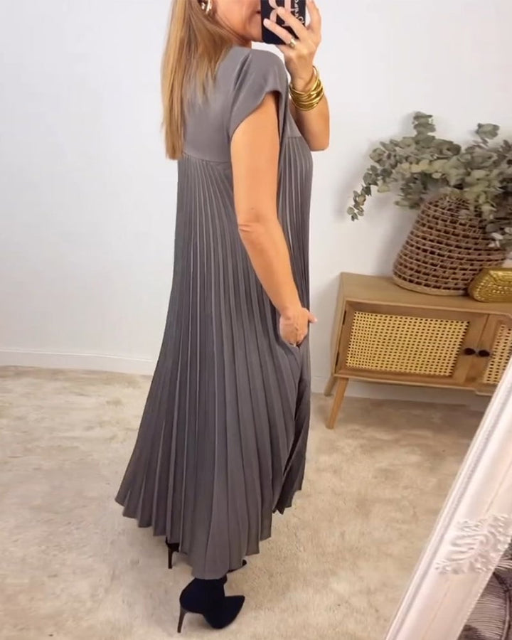 Formal or casual women's pleated dress. Elegant, comfortable, and sleeveless for versatility.