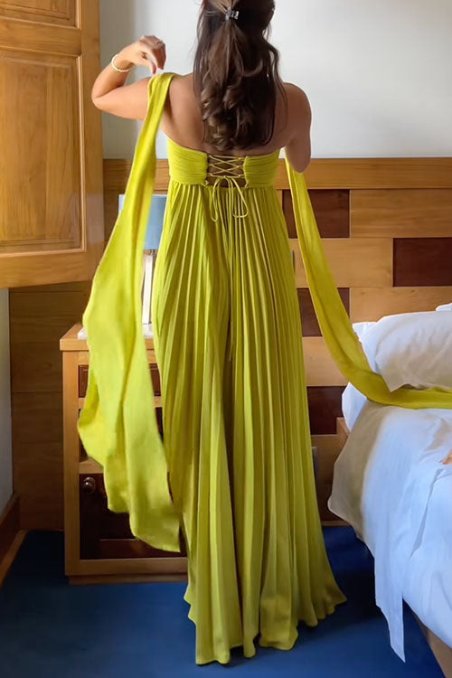 Flowy off-shoulder maxi dress in vibrant yellow, with stylish lacing detail and elegant pleated skirt. Women's evening wear.