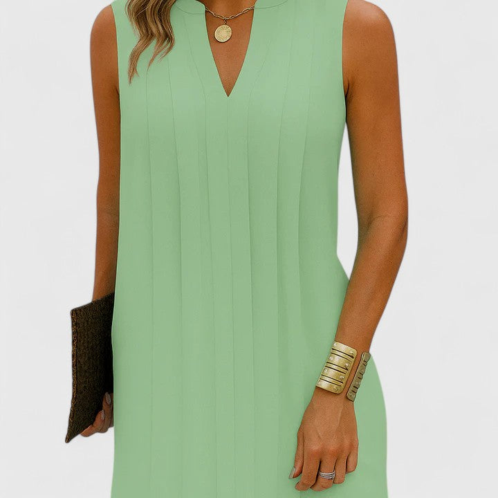 Elegant V-neck dress, shown on a model, flattering fit & timeless style.