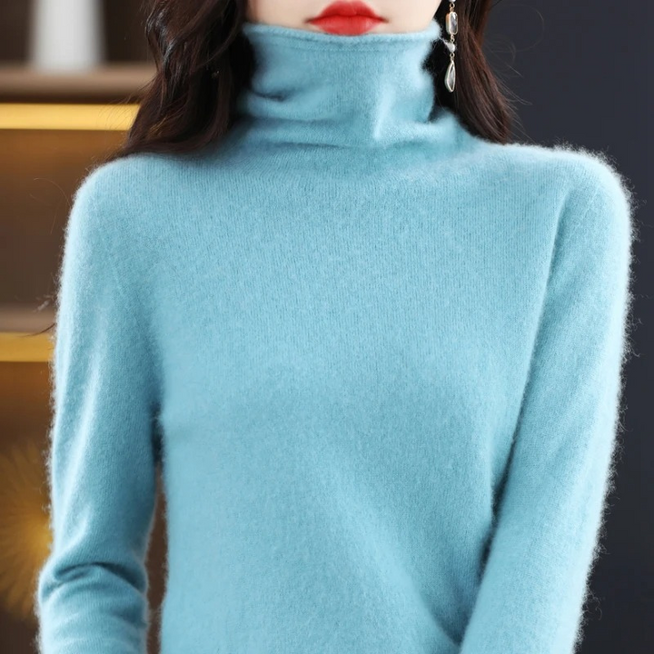 Stylish women's warm pullover. Soft roll neck long sleeve top for everyday chic comfort.