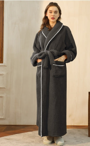 Close-up of plush fabric on a unisex over-knee bathrobe, highlighting soft touch & warmth for winter.