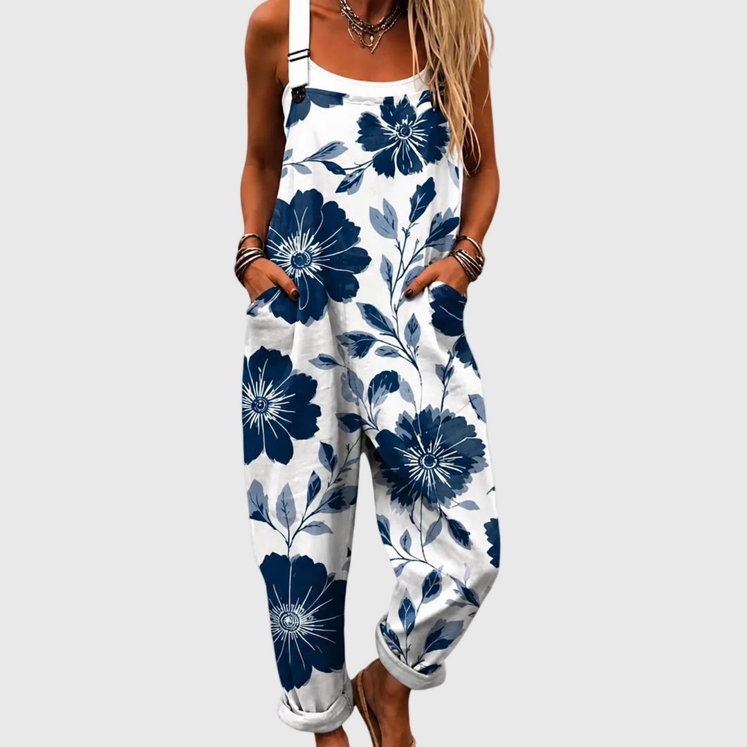 Women's elegant indigo floral overalls jumpsuit, relaxed fit for casual summer fashion or vacation.