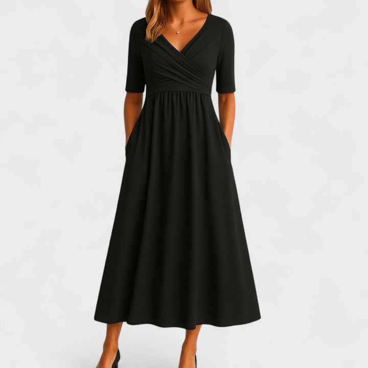 Comfortable grey V-neck midi dress for women, featuring elbow sleeves and convenient side pockets.
