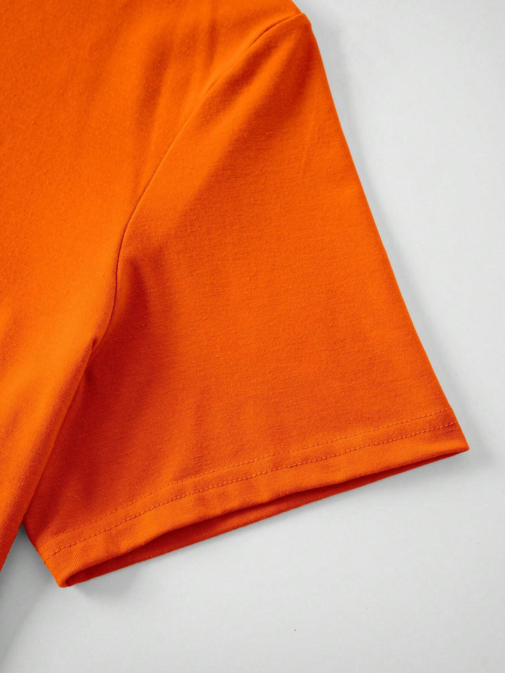 Men's slim-fit King's Day T-shirt in vibrant orange, ideal festive casual wear to show pride.