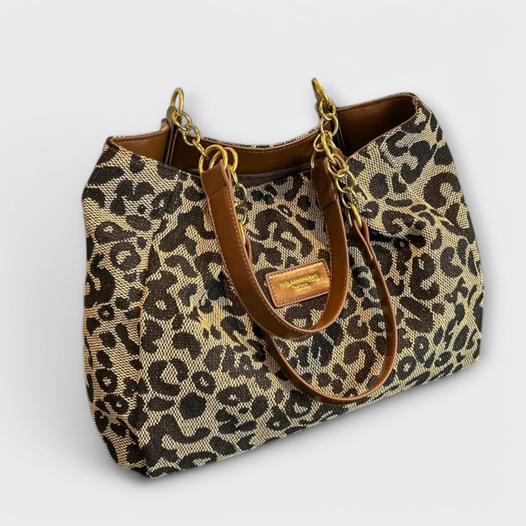 Women's leopard print canvas tote bag, perfect for everyday fashion. Stylish shoulder bag with spacious interior.