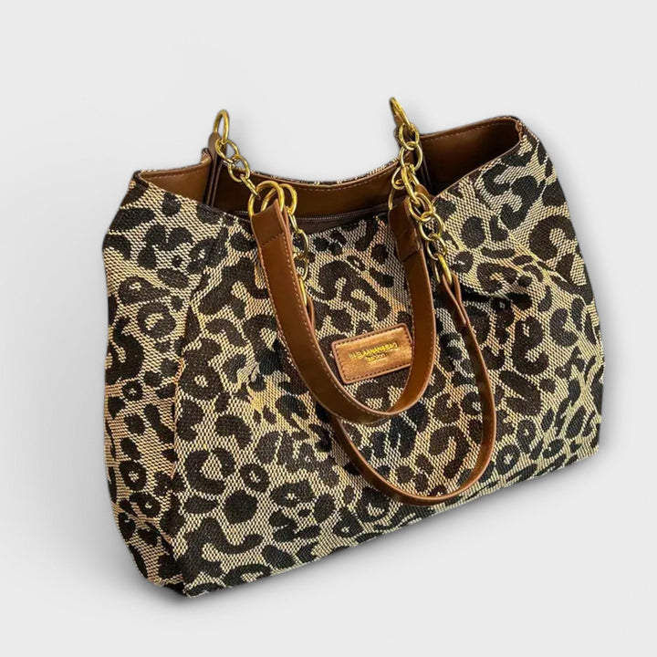 Women's leopard print canvas tote bag, perfect for everyday fashion. Stylish shoulder bag with spacious interior.