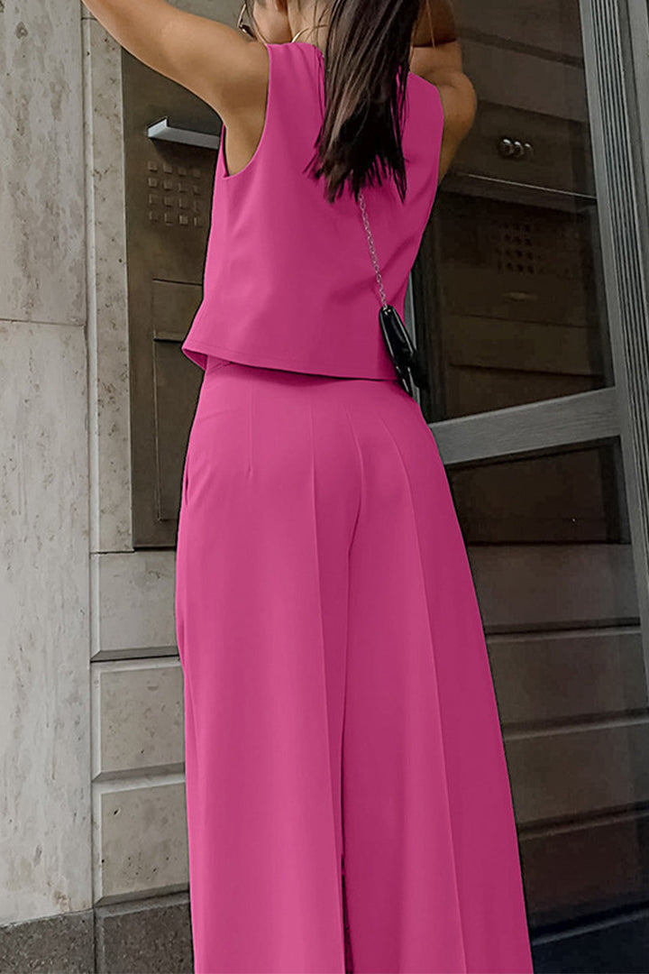 Sophisticated women's coordinated outfit: sleeveless waistcoat & flowing wide-leg trousers. Business chic style.