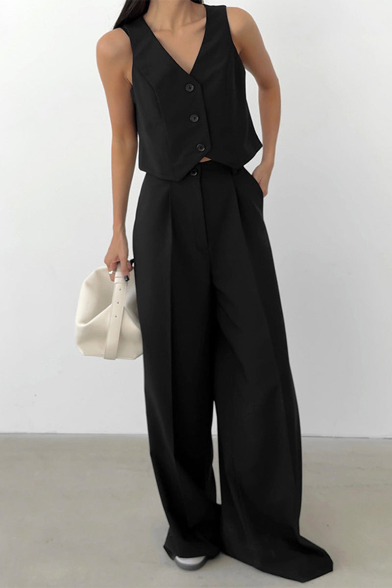 Fashionable women's two-piece set: sleeveless waistcoat and high-waisted wide-leg trousers. Coordinated style.