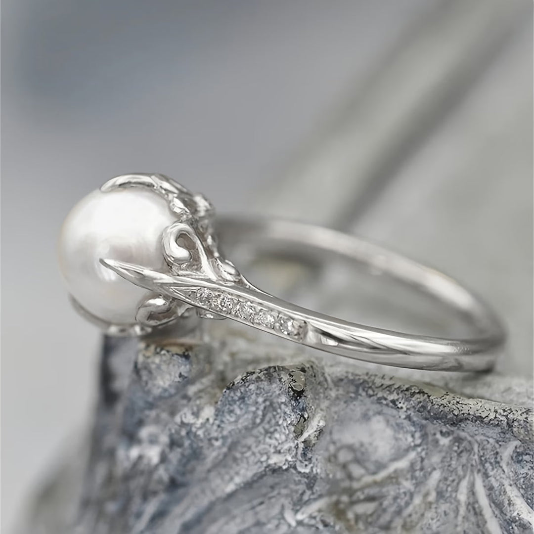 Women's delicate gold pearl and crystal ring. An elegant statement ring perfect for any occasion. Fashion jewelry.