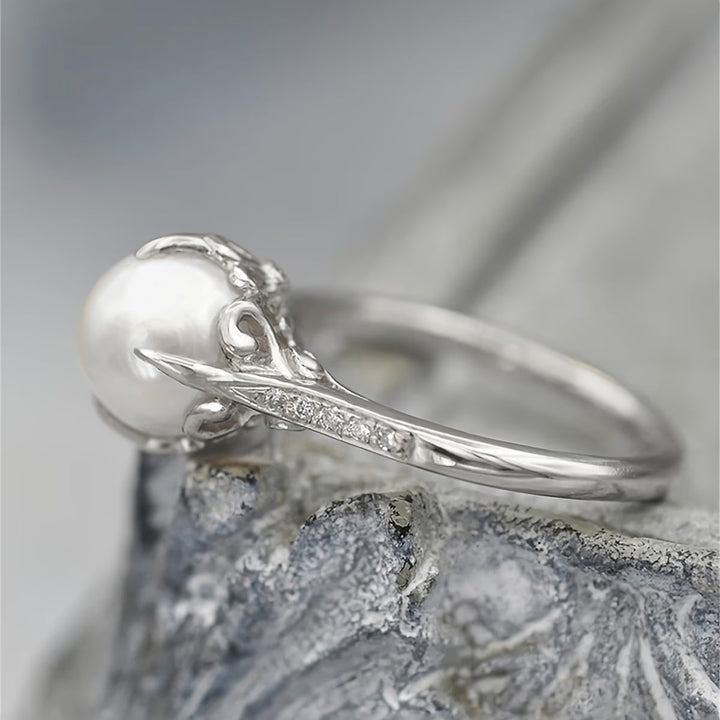 Women's delicate gold pearl and crystal ring. An elegant statement ring perfect for any occasion. Fashion jewelry.