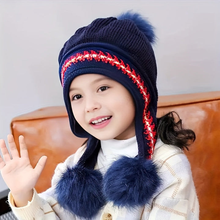 Warm kids' ear flap pom pom winter hat. Soft knit, perfect for toddlers to stay cozy in cold weather.
