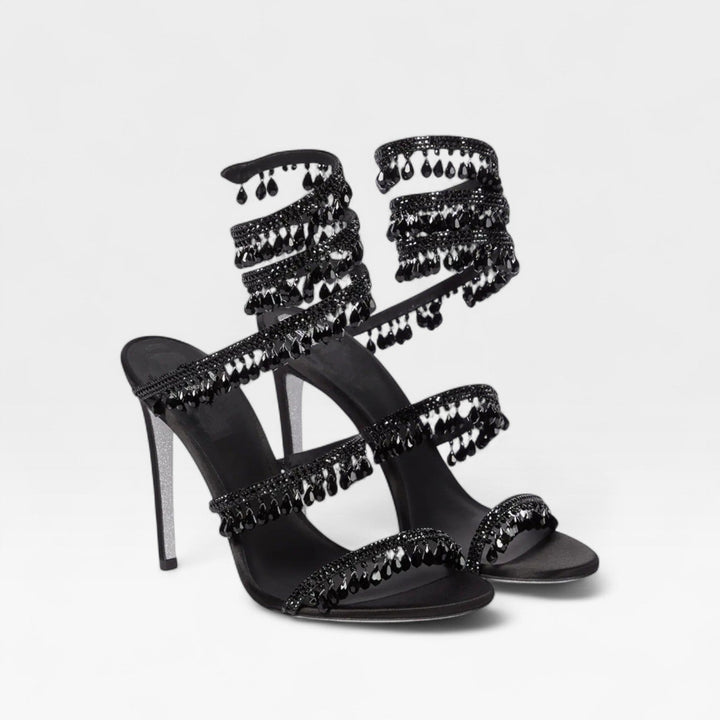 Dazzling women's crystal strappy high heels, a sophisticated choice for evening attire.