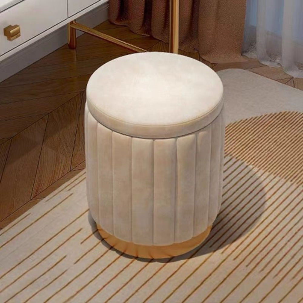 Round upholstered ottoman, mirrored storage, a stylish and practical footrest.