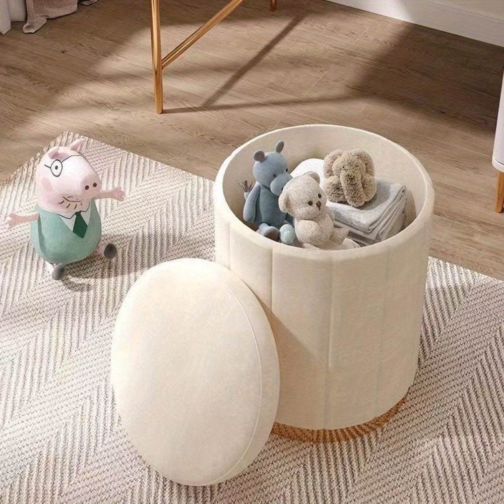 Modern round storage pouf, mirrored base, versatile for home or hallway.