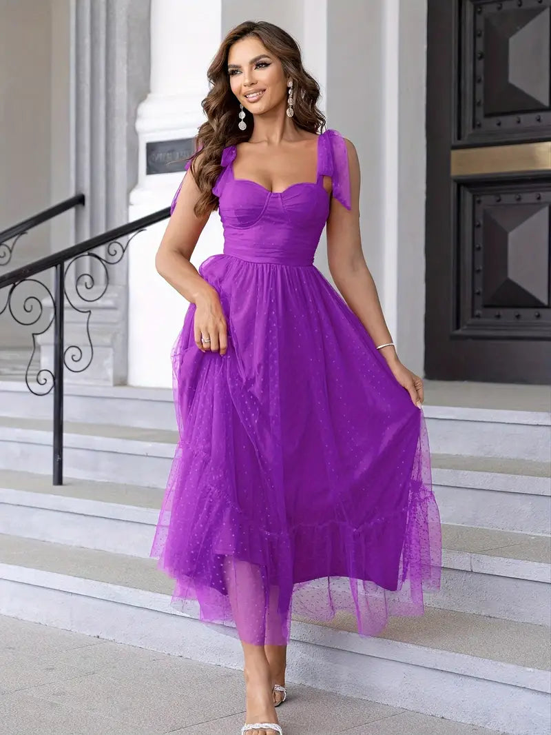 Long mesh cami strap gown for women, an elegant A-line formal dress with flounce hem for evening events.