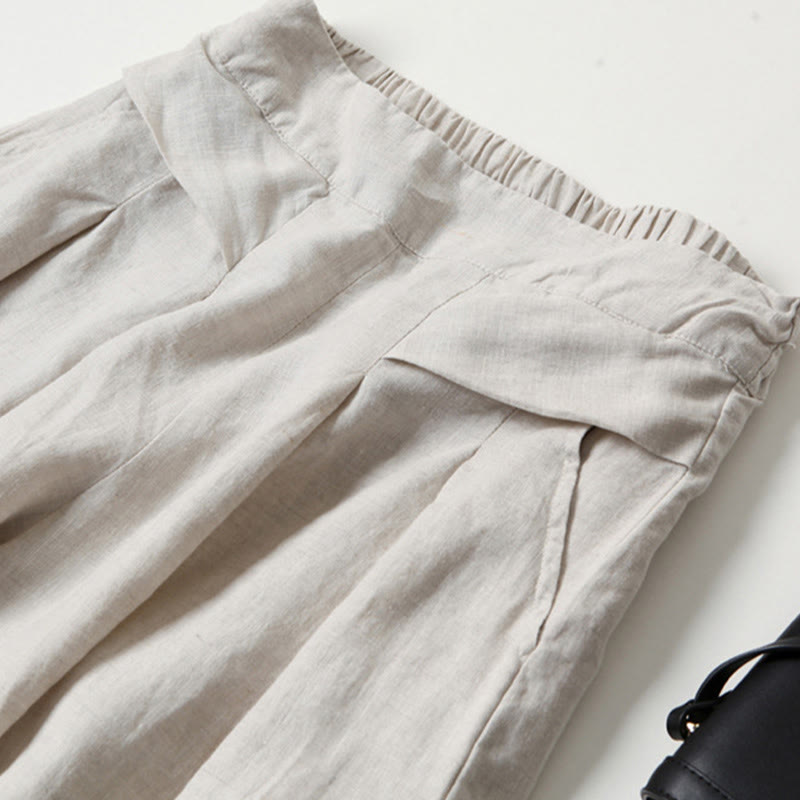 Women's high-rise wide-leg trousers, defining an elegant and modern silhouette.