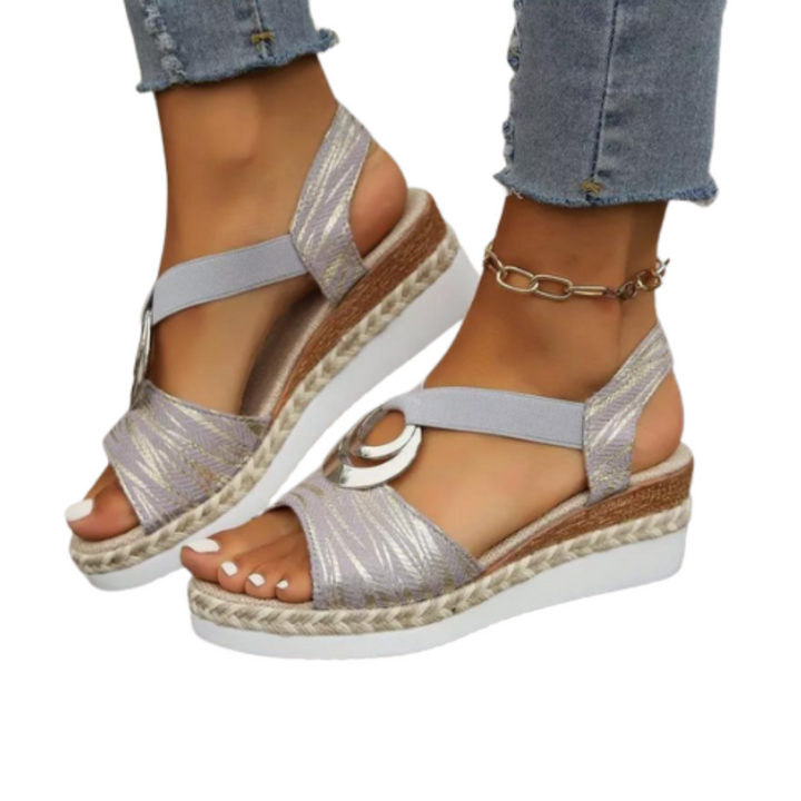 Comfortable women's wedge sandals with cushioned sole & supportive design for stylish summer everyday wear.