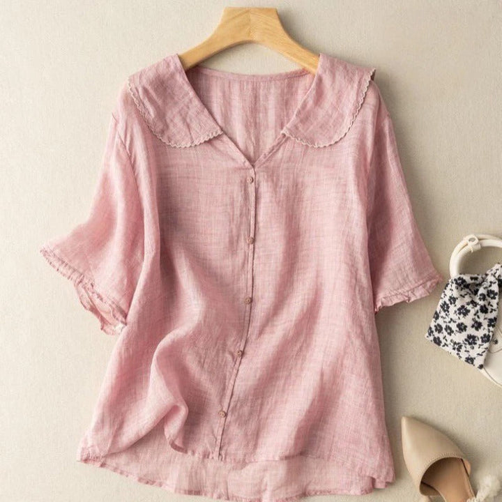 Stylish women's vintage blouse with button detail and long sleeves, great for effortless spring/autumn fashion.