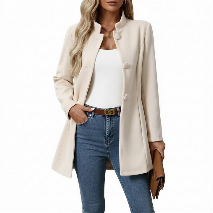 Stylish women's A-line coat with prominent buttons. Elegant fall outerwear, perfect for a chic and classic look.