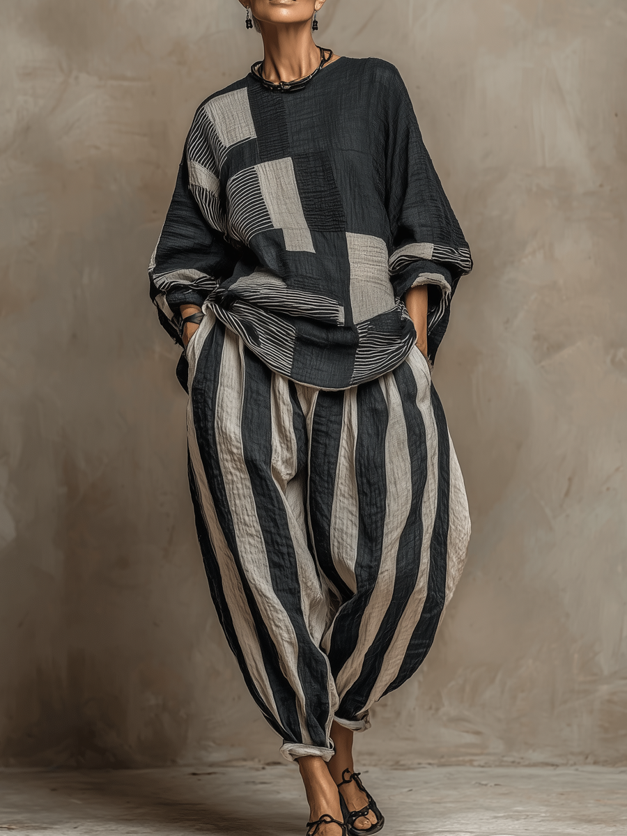 Women's chic colour-block long sleeve top and striped wide-leg trouser two-piece set, ideal for casual fall wear.